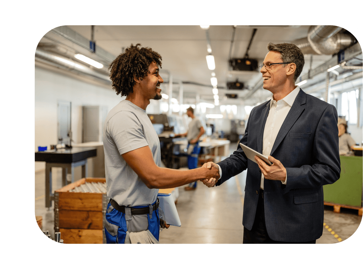 Men in warehouse shaking hands