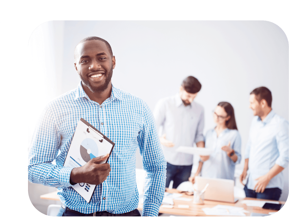 Office workers with paperwork and laptop